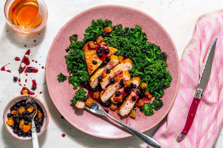 Blueberry-apricot pork chops with sautéed kale