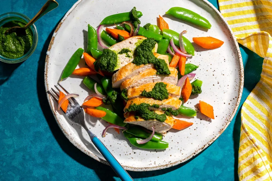 Moroccan chicken with carrots, snap peas, and spicy green harissa