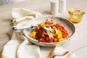 Chicken and sweet potato skillet with enchilada sauce and scrambled eggs