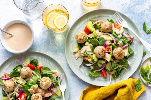 Greek meatballs with tomato-cucumber salad and lemon-tahini dressing