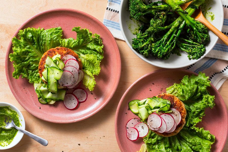 Lettuce-wrapped salmon burgers with pickled zucchini and baby broccoli