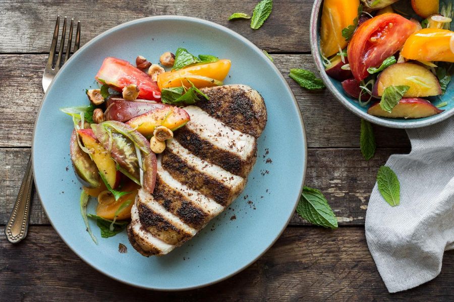 Harissa-rubbed pork chops with peach-tomato salad