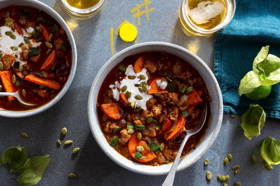 Spicy chorizo and tomatillo chili with sweet potato and pumpkin seeds