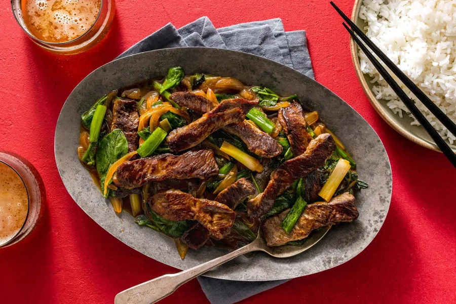 Mongolian beef and spinach stir-fry over steamed rice