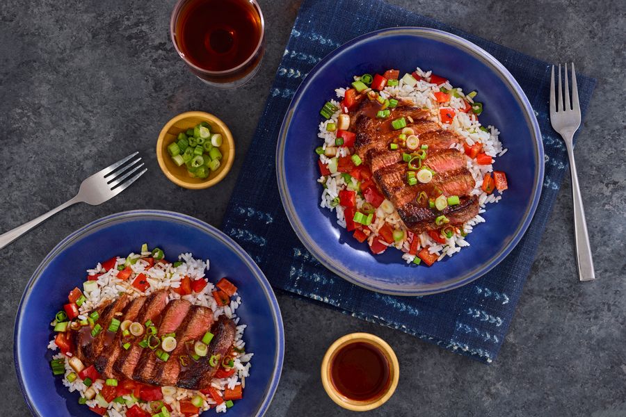 Spicy Mongolian steaks over jasmine rice with bell pepper and scallions