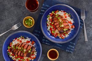 Spicy Mongolian steaks over jasmine rice with bell pepper and scallions