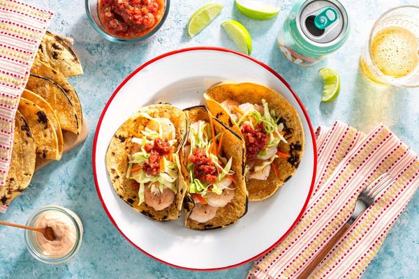Salmon tacos with cabbage slaw, salsa roja, and chipotle yogurt