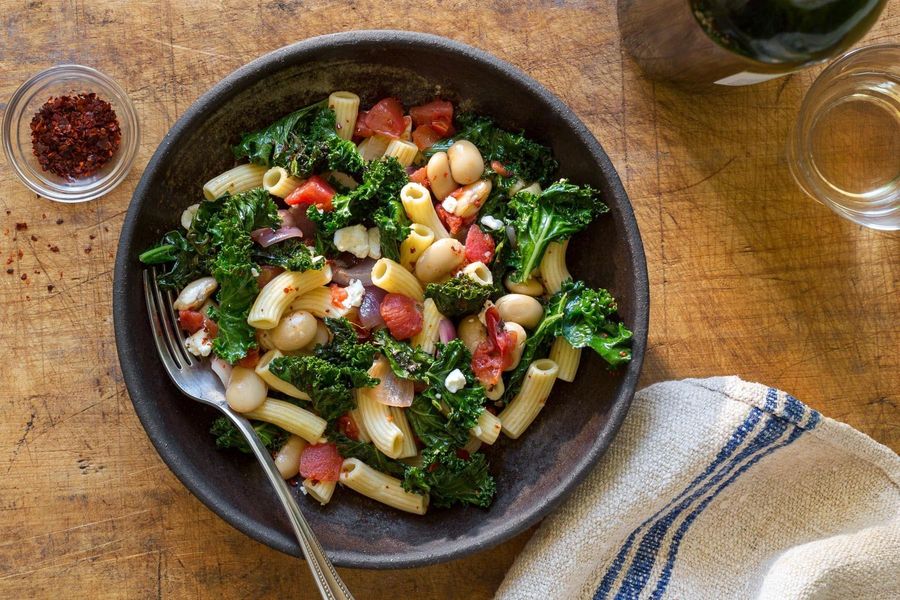 Gluten-free penne with white beans, tomatoes, and kale