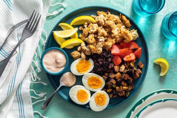 Mediterranean meze platter with lamb, eggplant, and hard-cooked eggs