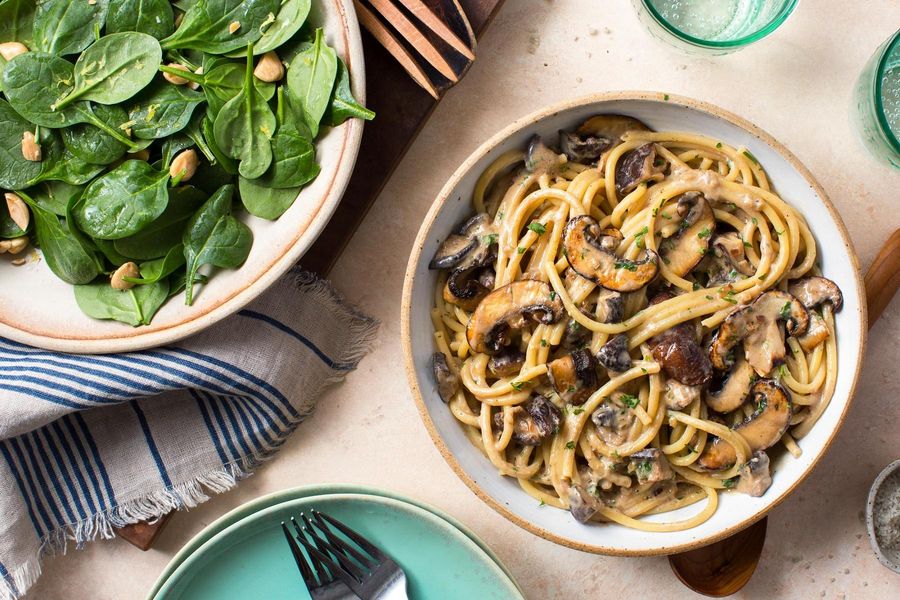 Velvety mushroom bucatini with kale and Marcona almond salad