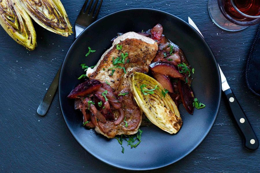 Seared pork with endive, plums, and caramelized onions