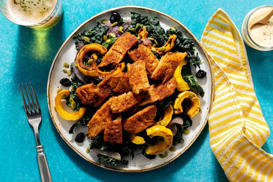 Kale salad with your choice of protein, squash, and dried cherries