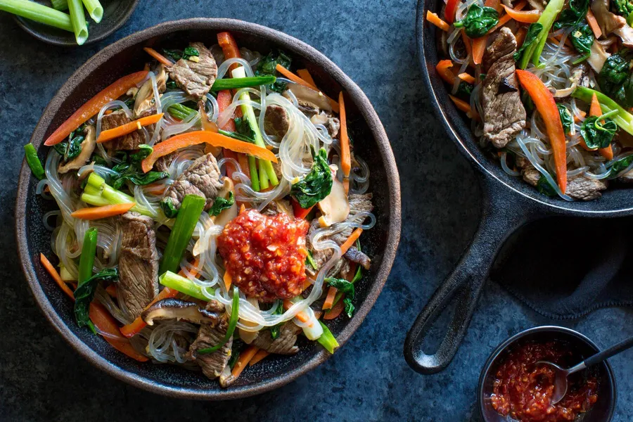 Korean steak japchae with glass noodles and stir-fried vegetables