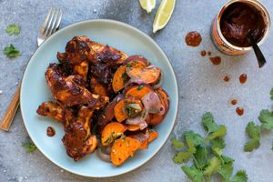 Spicy barbacoa chicken wings with roasted sweet potato and salsa verde