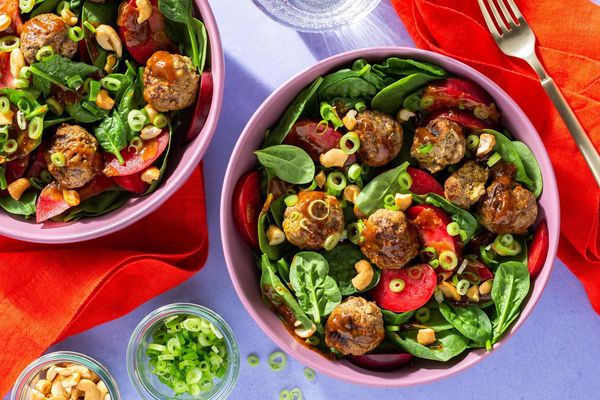 Lemongrass chicken meatballs with spinach-plum salad and cashews