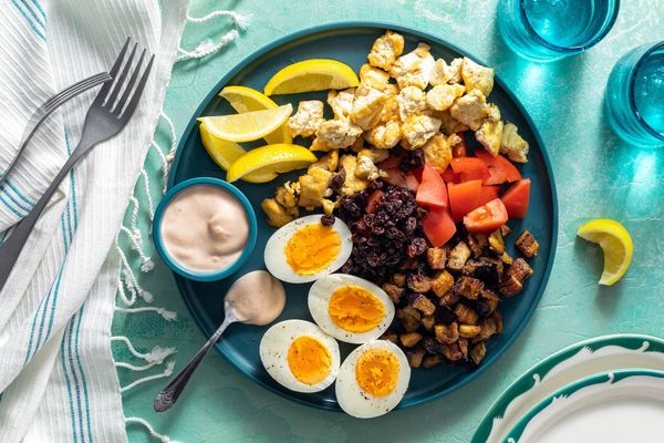 Mediterranean meze platter with lamb, eggplant, and hard-cooked eggs