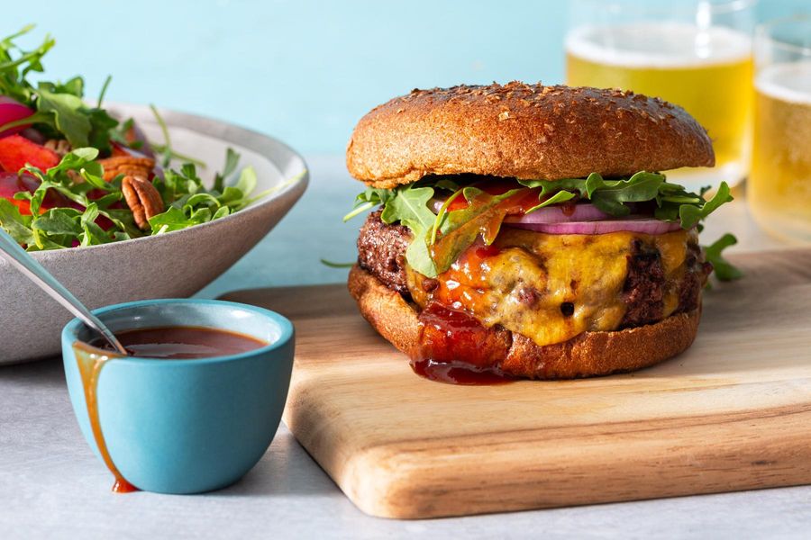 Memphis BBQ cheeseburgers with plum, pecan, and arugula salad