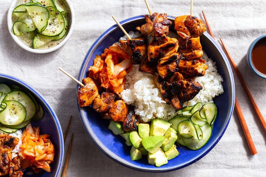 Korean rice bowls with sticky-sweet BBQ chicken skewers and kimchi