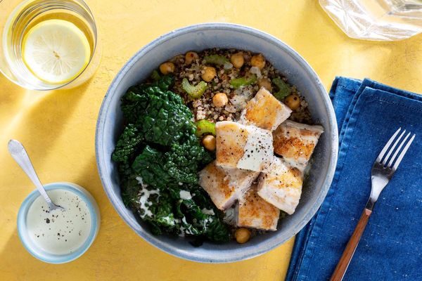 Salmon and quinoa bowls with wilted greens and citrus dressing