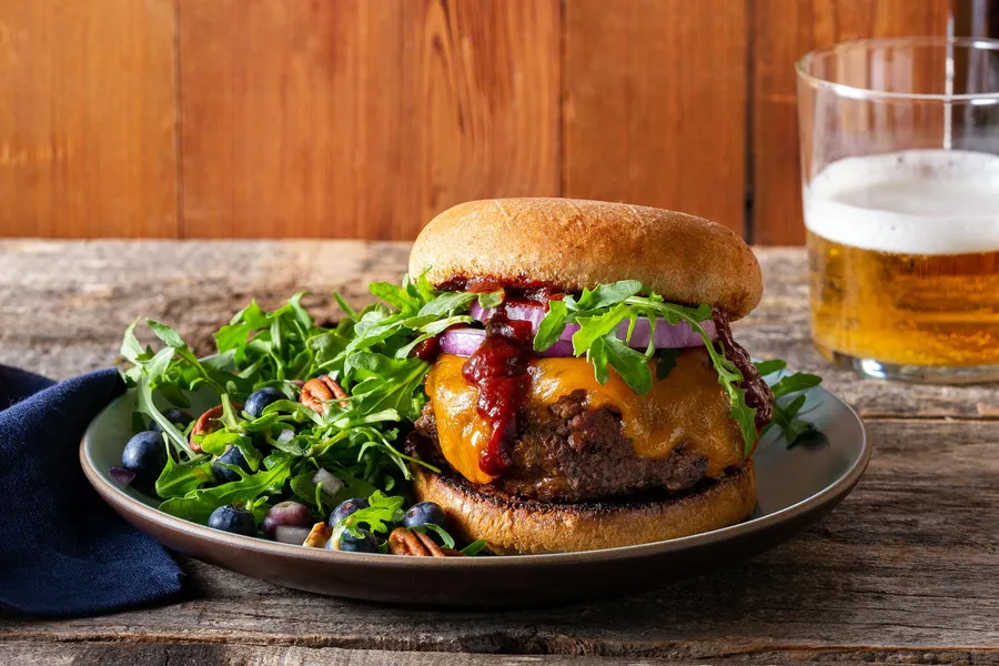 Memphis BBQ cheeseburgers with blueberry, pecan, and arugula salad