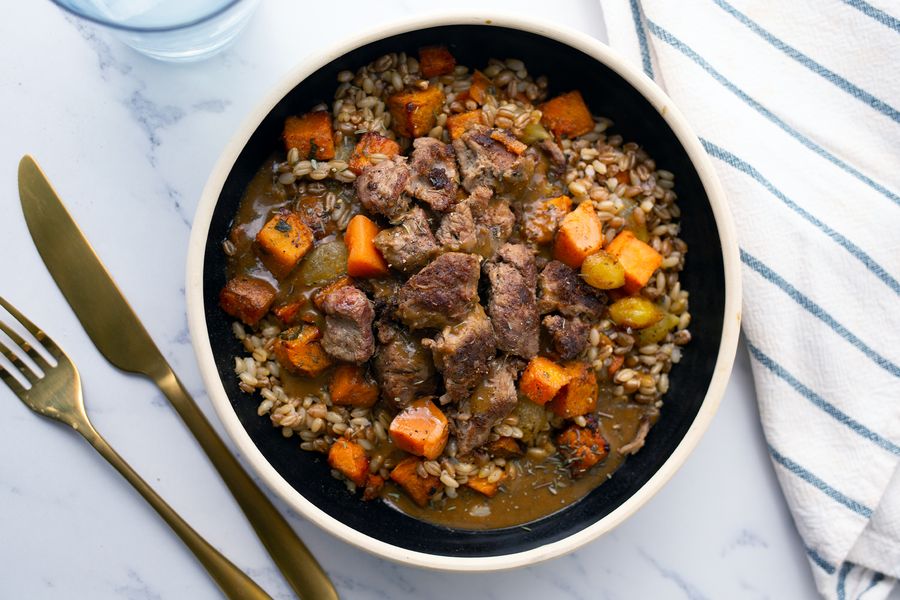 Slow cooked beef and roasted root vegetables bowl