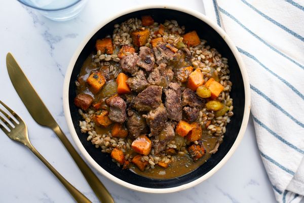 Slow cooked beef and roasted root vegetables bowl