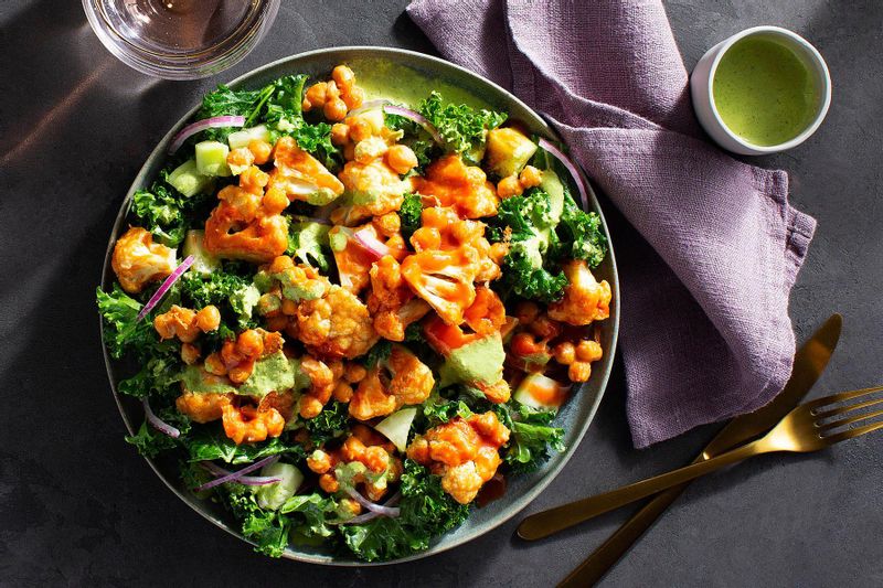 Buffalo Cauliflower and Chickpeas over Kale-Cucumber Salad | Sunbasket