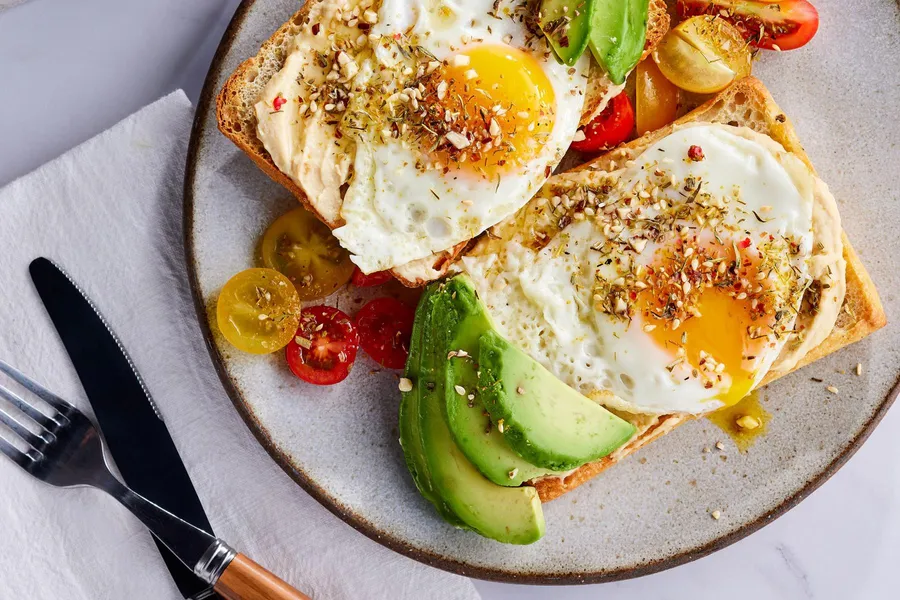 Avocado Toast with Fried Egg, Dukkah Spice, and Cherry Tomatoes