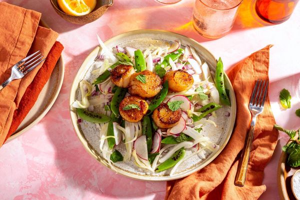 Fennel-spiced pork over snap pea and radish salad