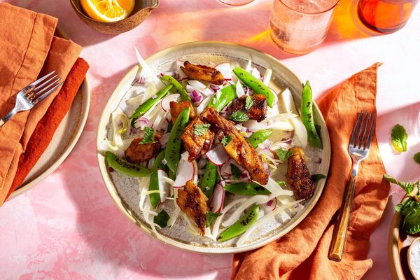 Fennel-spiced pork over snap pea and radish salad