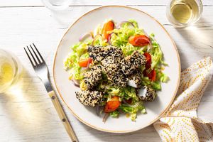 Sesame-crusted fish nuggets with orange-glazed vegetables