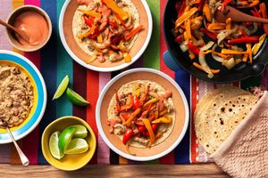 Tex-Mex vegetable fajitas with cheesy refried beans and sazón-spiced yogurt