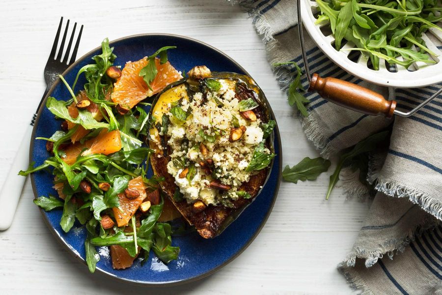 Roasted acorn squash with couscous and arugula-orange salad