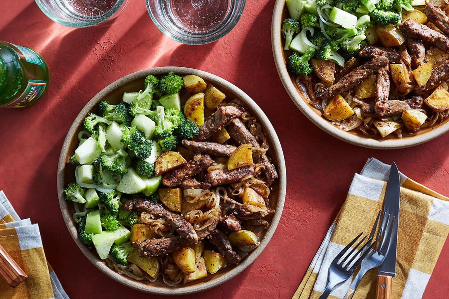 Mole-spiced beef and potatoes with broccoli and green romesco salad