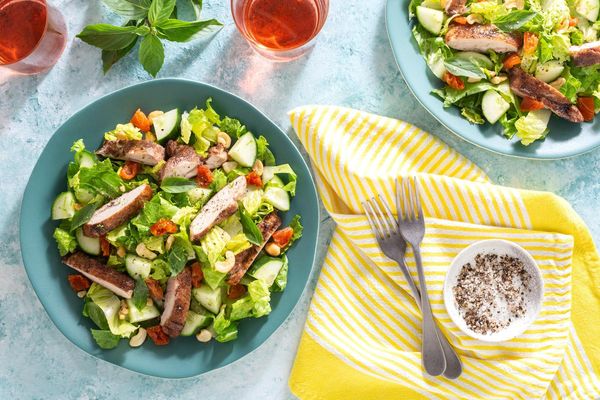 Southeast Asian sesame-lime salad with cashews, cucumber, and basil