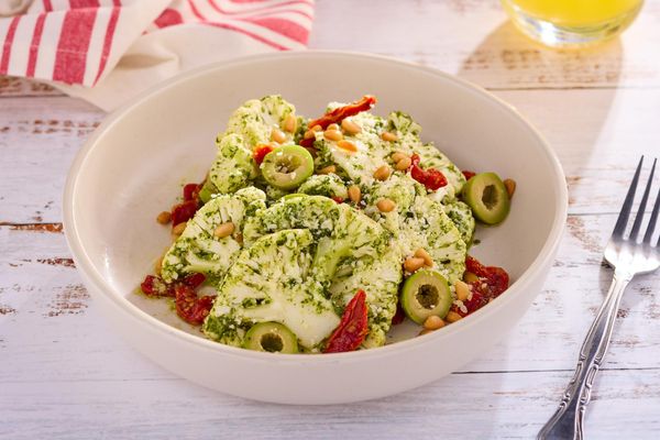 Pesto Parmesan Cauliflower Salad with Sun-Dried Tomatoes and Pinenuts