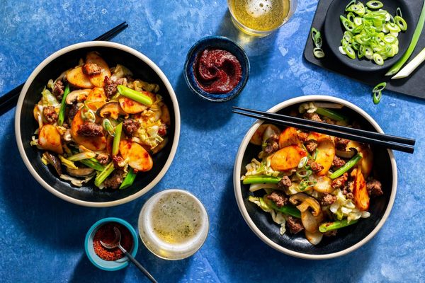 Korean tteokbokki rice cake stir-fry with pork and shiitake mushrooms