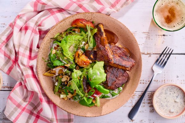 BBQ ribs and stone fruit salad with charred peppers and sweet lemon-basil dressing