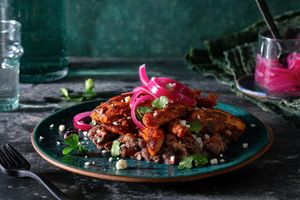 Pollo pibil with Yucatán-style beans and queso fresco