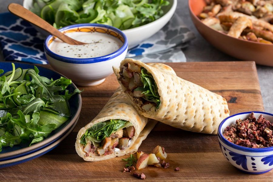 Superfast lavash wraps with pork, cucumber ribbons, feta, and olives