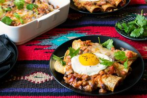 Two-bean enchiladas with Southwestern chile sauce and fried eggs