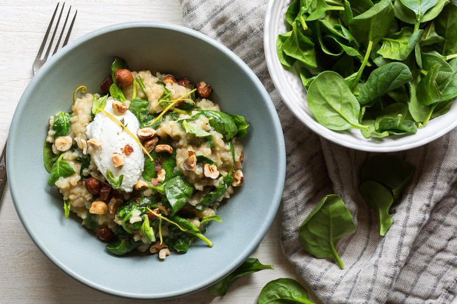 Spinach risotto with fresh ricotta and hazelnuts