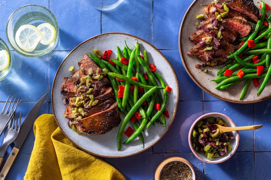 French Quarter–style Black Angus rib-eye steaks with olive tapenade