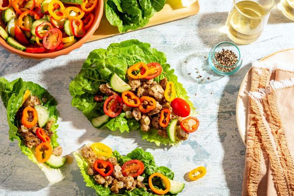 Greek lamb lettuce cups with sweet mini peppers, cucumber, and tomatoes