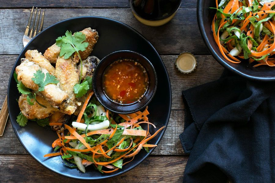 Shanghai chicken wings with ginger-lime dipping sauce and bok choy slaw