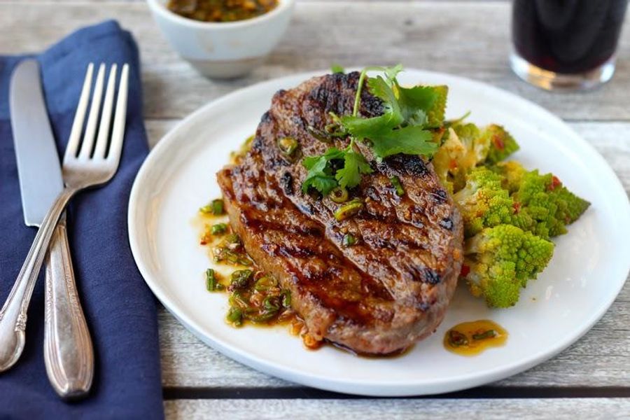 Grilled steak and romanesco with sambal chile and lime