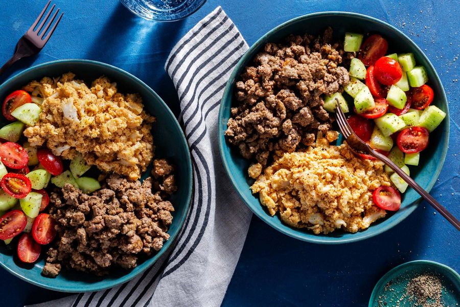 Kefta-spiced beef bowls with cauliflower hummus and tomato salad