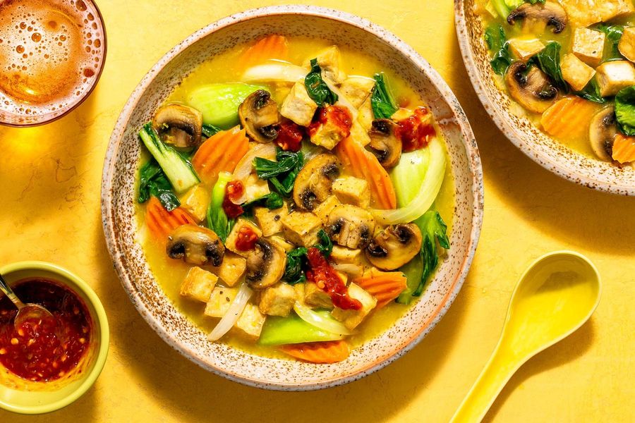 Lemongrass soup with baby bok choy, carrots, and mushrooms