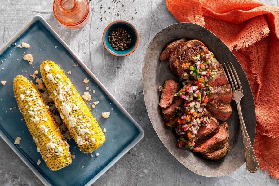 Black Angus steaks with Mexican street corn and salsa cruda