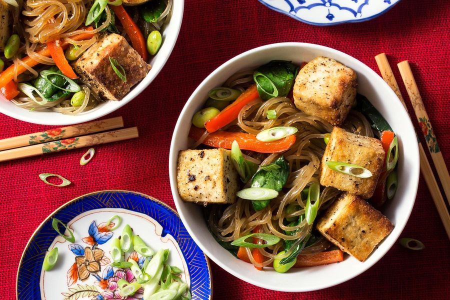 Salt-and-pepper tofu stir-fry with glass noodles, edamame, and spinach